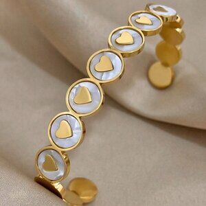 MULTI TINY HEART GOLD AND WHITE BRACELET ON DISPLAY
